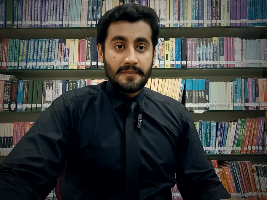 Hammad Shaukat in a library